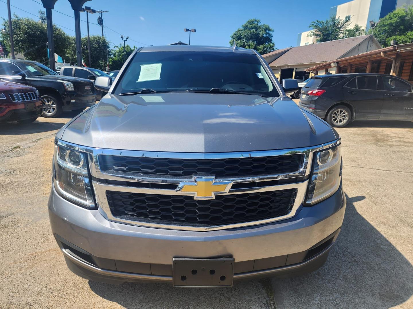 2019 Gray /Black Chevrolet Suburban (1GNSKHKC1KR) , located at 945 E. Jefferson Blvd, Dallas, TX, 75203, (214) 943-7777, 32.752514, -96.811630 - Photo#1